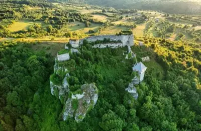 an aerial view of a castle in the forest at Relax Rose Apartment in Kulen Vakuf