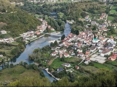 an aerial view of a town next to a river at Relax Rose Apartment in Kulen Vakuf