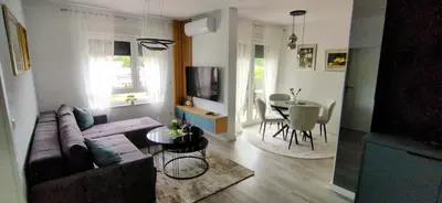 a living room with a couch and a table at Apartman Bonaca in Kiseljak