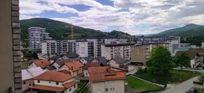 a view of a city with buildings and mountains at Apartman Bonaca in Kiseljak