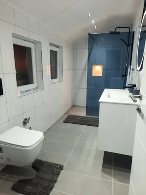 a bathroom with a toilet and a sink at Bihać Kralje in Bihać
