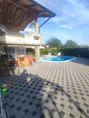 a patio with a swimming pool and a house at Bihać Kralje in Bihać