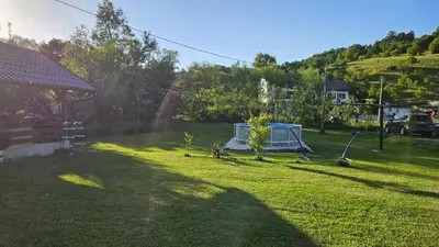 a yard with a tent in the grass at Smjestaj na selu KLARA in Staro Selo
