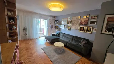 a living room with a couch and a table at Apartman Lorka in Banja Luka