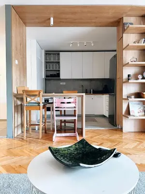a kitchen and living room with a table and chairs at Apartman Lorka in Banja Luka