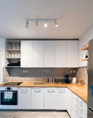a kitchen with white cabinets and a sink at Apartman Lorka in Banja Luka