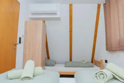 a room with two beds and a air conditioner at UnaSoul in Bihać