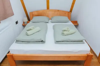 a bedroom with two beds with white sheets and pillows at UnaSoul in Bihać