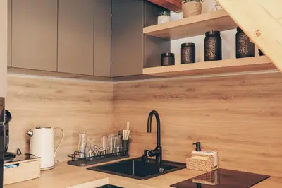 a kitchen with a sink and a counter at Brvnara Tribalija