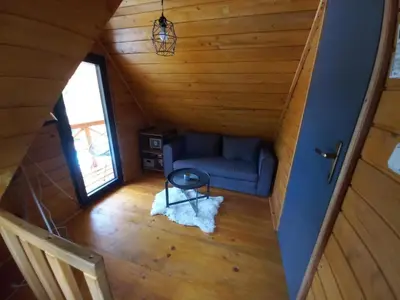 an overhead view of a living room in a log cabin at Brvnara Tribalija