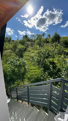 a view of a field from the balcony of a house at Vikendica Malekin in Ripci
