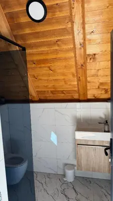 a bathroom with a toilet and a sink at Vikendica Malekin in Ripci