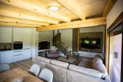 a living room with a couch and a tv at Villa Ella in Bihać