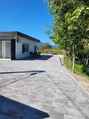 a driveway in front of a house at Apartman A&A in Ivišovo Greblje
