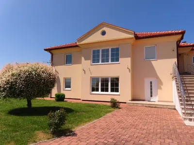 a house with a brick driveway at Kuća za odmor KUNA in Kupres