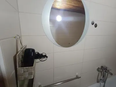 a bathroom with a mirror and a sink at Vlasic Relax Location in Vlasic