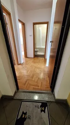 a view of a hallway with a room with a bathroom at 7th Sky in Banja Luka