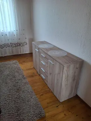 a wooden cabinet in the corner of a room at Vikendica 