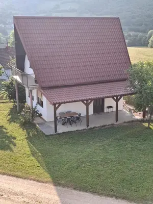 an overhead view of a house with a table and a roof at Vikendica 