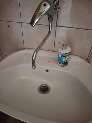 a sink with a faucet on top of it at Vikendica 