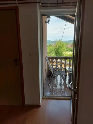 a room with a door to a balcony with a view at Apartman Aldina in Bihać
