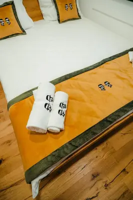 a bed with two towels with the word sleep on it at Villa Dos Padrinos in Banja Luka