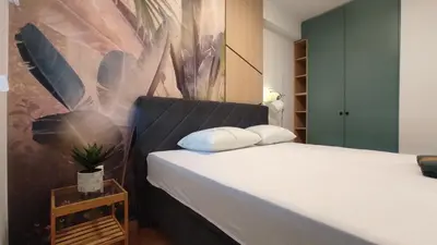 a bedroom with a bed with two pillows on it at Apartment Lena 51 in Banja Luka