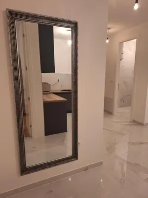 a mirror on a wall in a room at SD apartman - Trn in Ivišovo Greblje
