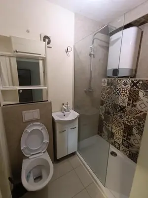 a bathroom with a toilet and a shower and a sink at Apartman Mejdan in Banja Luka