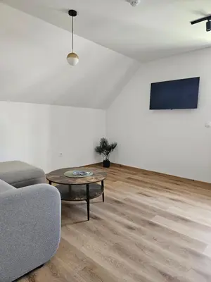 a living room with a couch and a table at Apartments NIM in Jajce