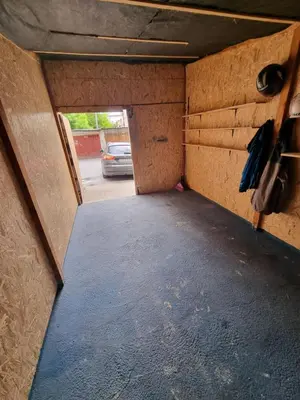 an inside view of a garage with a car parked at Nika-Simka in Banja Luka