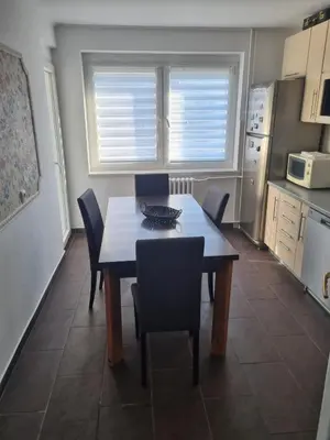 a kitchen with a table and chairs in a kitchen at Nika-Simka in Banja Luka