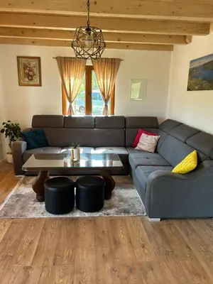 a living room with a couch and a table at Vikendica Diva