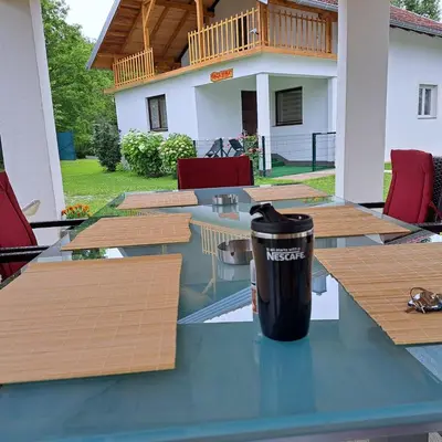 a table with a trash can sitting on top of it at Oaza mira BK in Bosanska Krupa