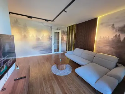 a living room with a couch and a table at Moments IV Banja Luka in Banja Luka