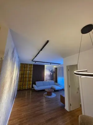 a living room with a couch and a table at Moments IV Banja Luka in Banja Luka