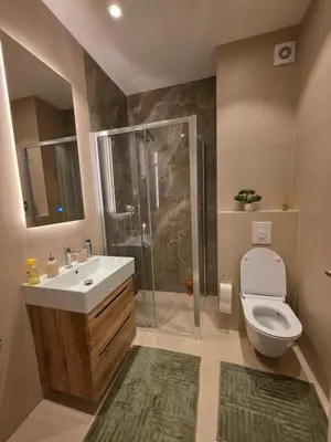 a bathroom with a toilet and a sink and a shower at Moments IV Banja Luka in Banja Luka