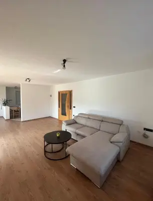 a living room with a couch and a table at Apartman Delminium in Tomislavgrad