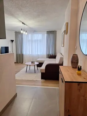 a living room with a couch and a table at Apartman KULA Livno in Livno