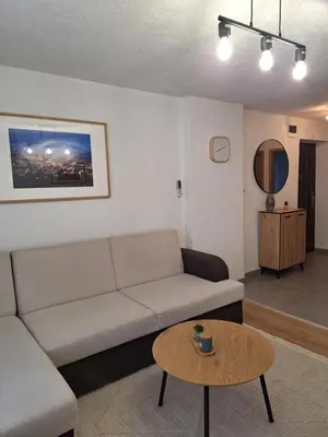 a living room with a couch and a table at Apartman KULA Livno in Livno