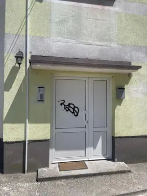 a door with a drawing of a spider on it at Apartman MM in Bihać