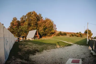 a house on top of a hill with a yard at Vikendica Buzadzija M&N