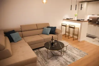 a living room with a couch and a table at Apartman Nikola in Livno