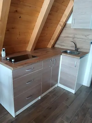 a kitchen in an attic with a sink and a counter at Villa Rustic