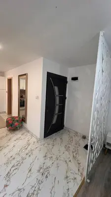 a room with a marble floor and a black door at White house Paradise in Bihać