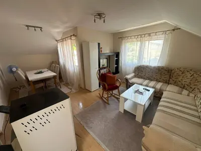 a living room with a couch and a table at Stan Travnik in Travnik