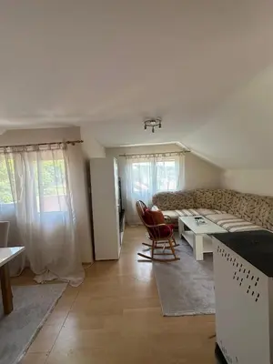 a living room with a couch and a table at Stan Travnik in Travnik