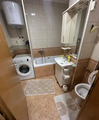 a small bathroom with a sink and a toilet at Apartment Bella - Tuzla, Mejdan in Tuzla