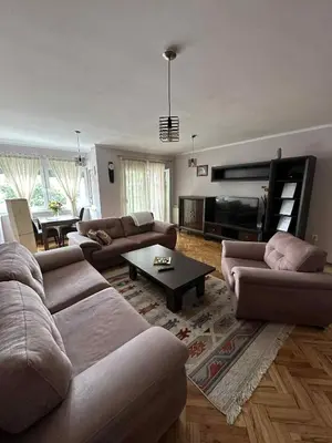 a living room with two couches and a table at Apartment Bella - Tuzla, Mejdan in Tuzla