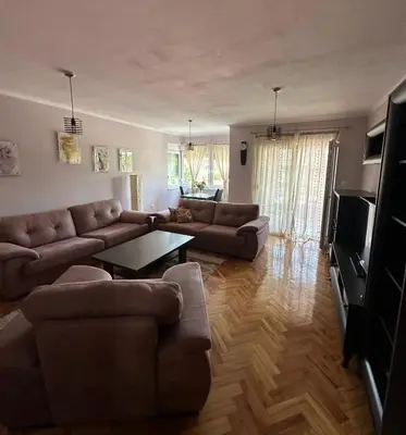a living room with a couch and a table at Apartment Bella - Tuzla, Mejdan in Tuzla